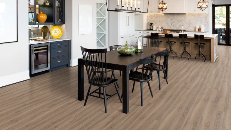 luxury vinyl plank flooring in an open concept kitchen and dining area